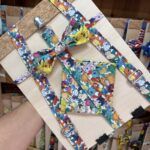 Cinturón de tela con personajes Pokémon coloridos y ajustable, ideal para niños y adolescentes.