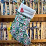 Rainbow Christmas stocking with Disney characters, soft white cuff, festive holiday decor.