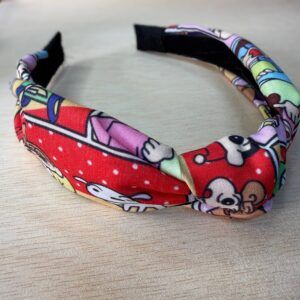 1. Diadema de tela con estampado de dibujos animados y colores vibrantes para mujer.