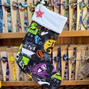 Guante de Navidad con diseño de sueños y personajes de Halloween.